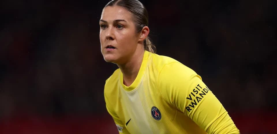 Goalkeeper in yellow jersey preparing for play