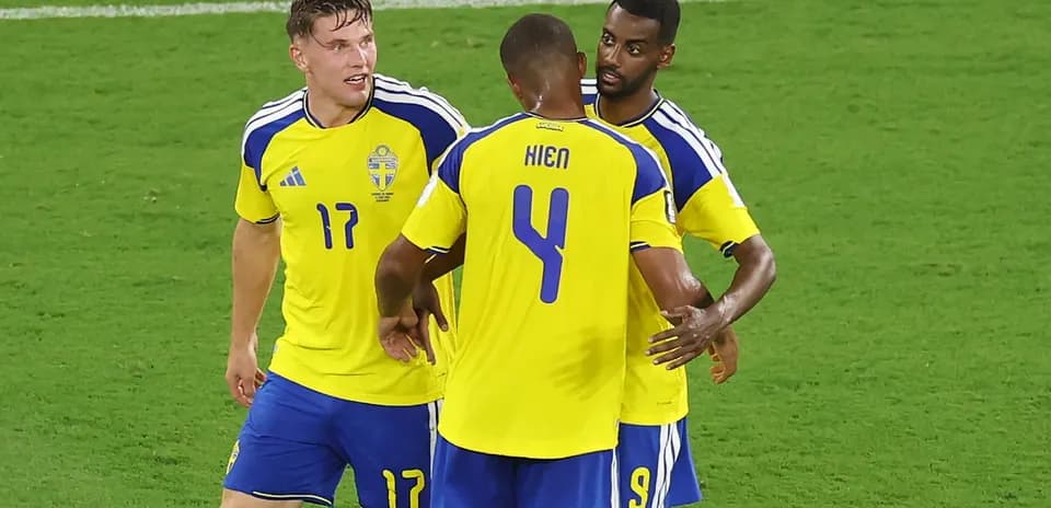 Sweden players celebrating a goal on the field