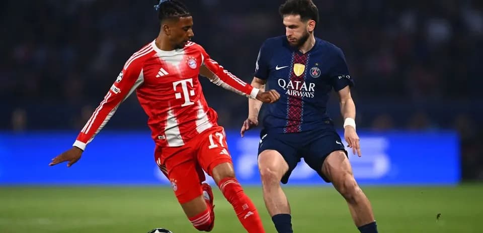 Bayern player tackling PSG opponent in match