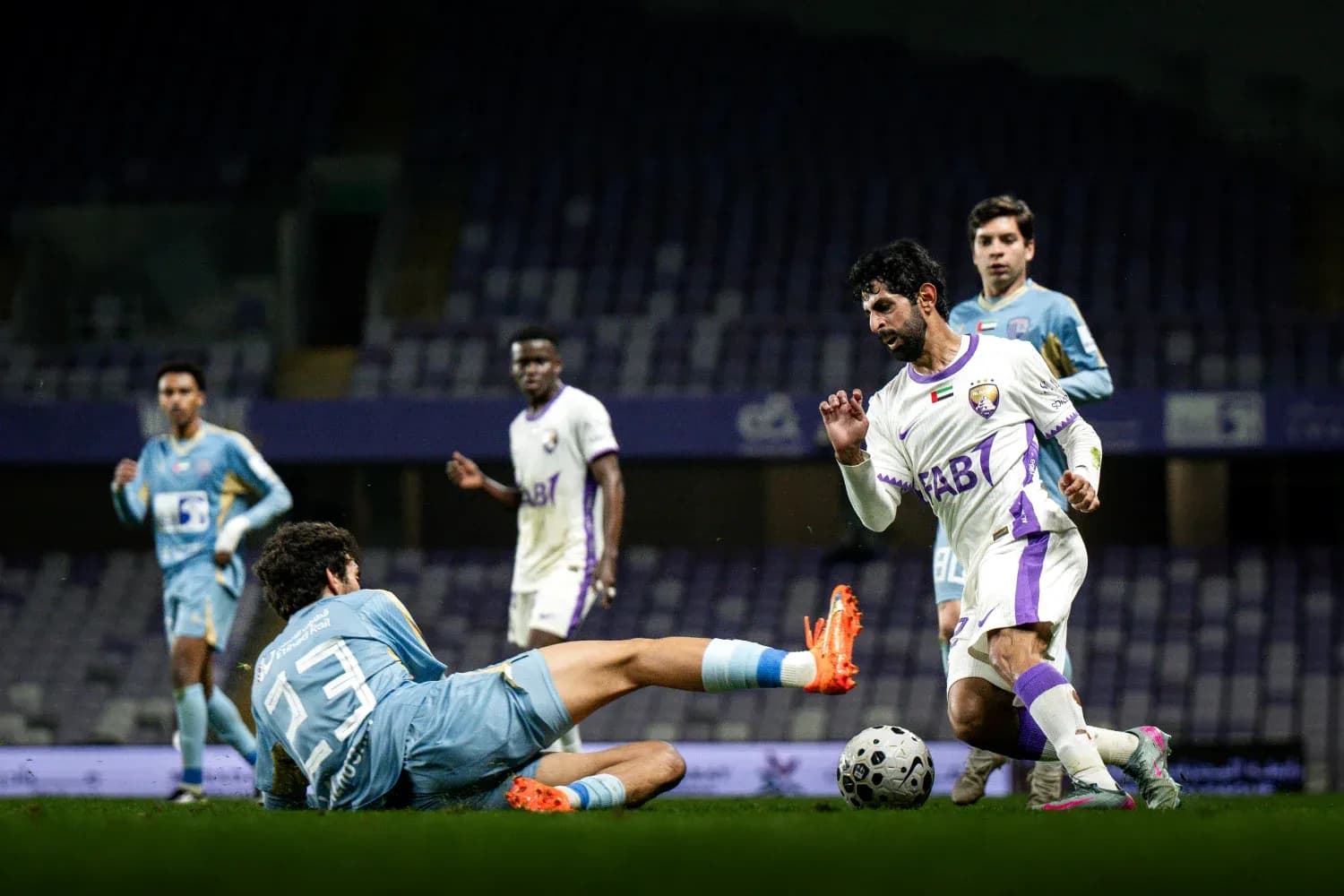 Player evades goalkeeper during U23 football match
