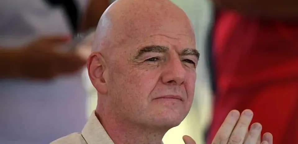 Man with bald head sitting and observing