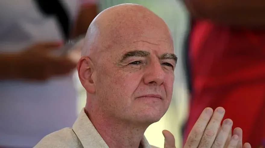 Man with bald head sitting and observing