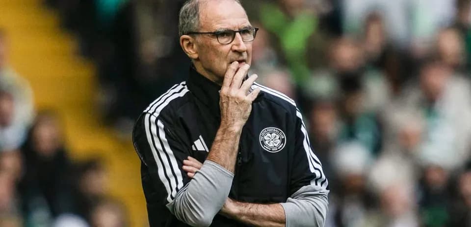 Manager observing match with arms crossed