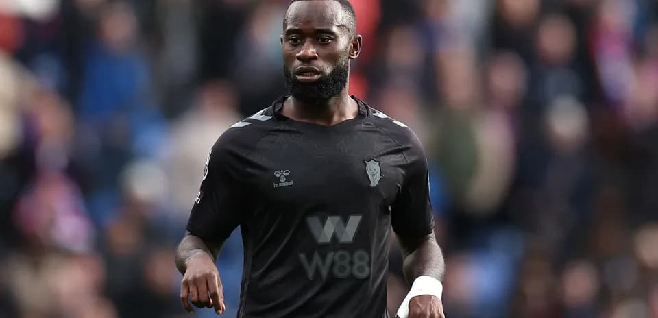 Player wearing black jersey during match action