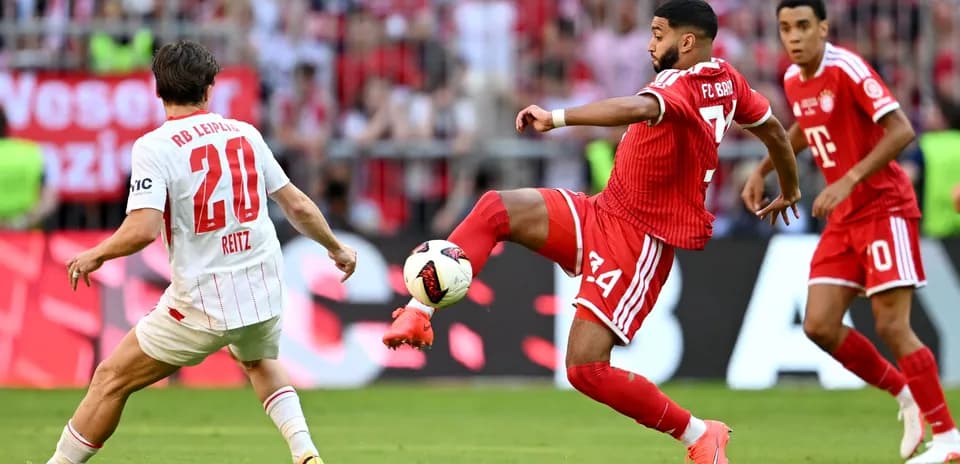 Player from FC Bayern kicking the ball against RB Leipzig