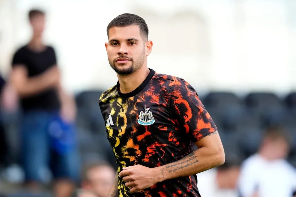Player wearing Newcastle United training kit on pitch