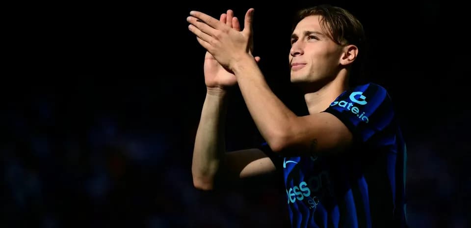 Player applauding fans in stadium during match