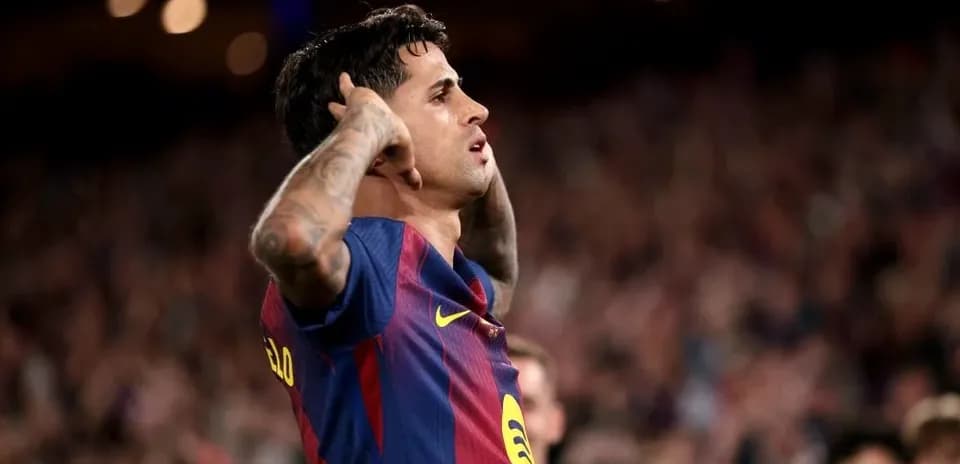 Player celebrating a goal at Camp Nou stadium
