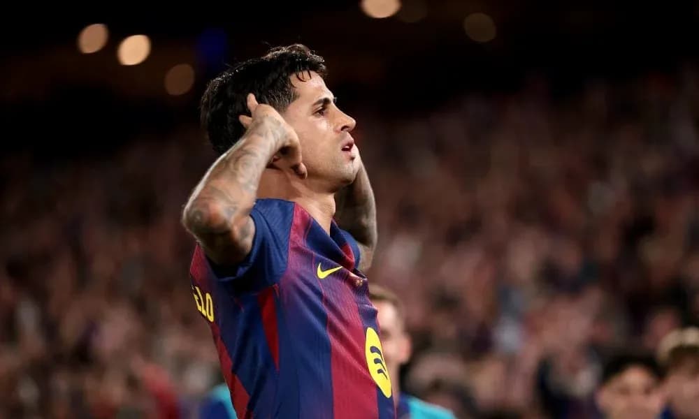 Player celebrating a goal at Camp Nou stadium