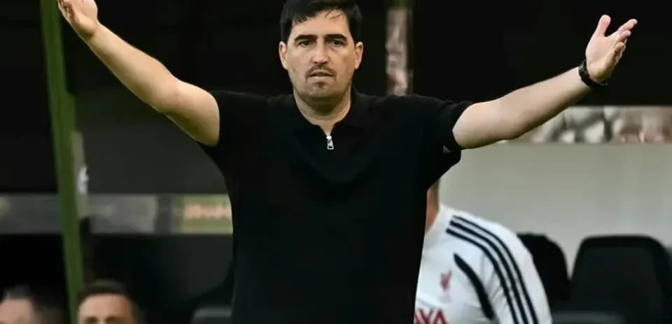 Coach gesturing from the sidelines during match