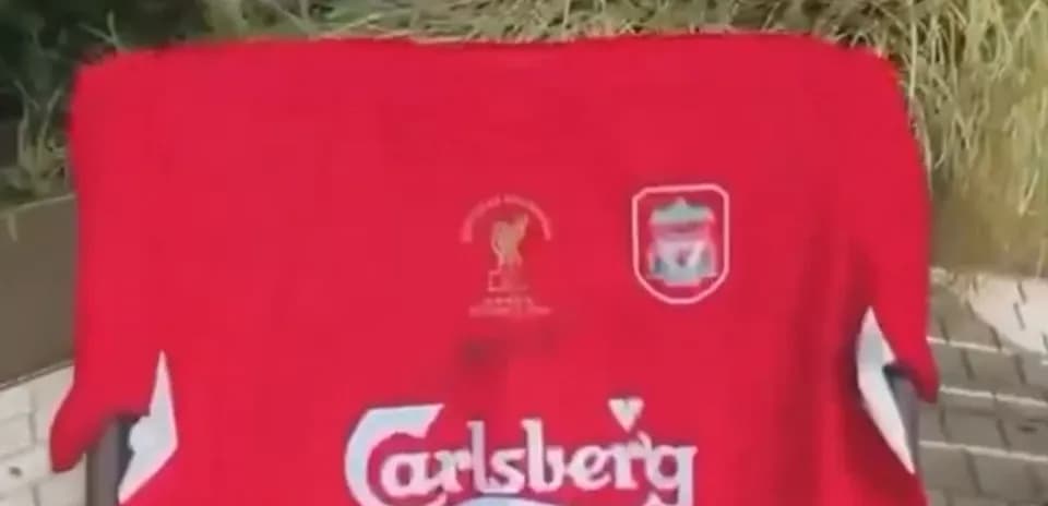 Liverpool jersey featuring Carlsberg logo displayed outdoors