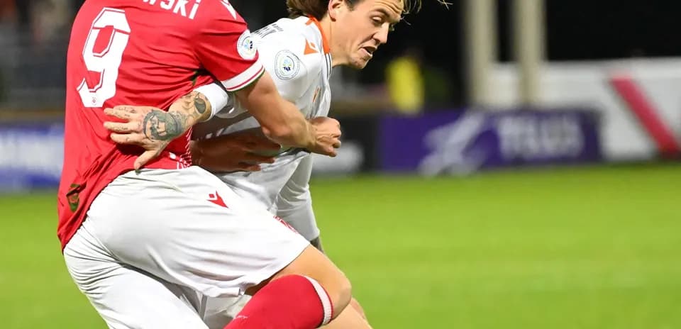 Player tackling during Forge vs Cavalry FC match