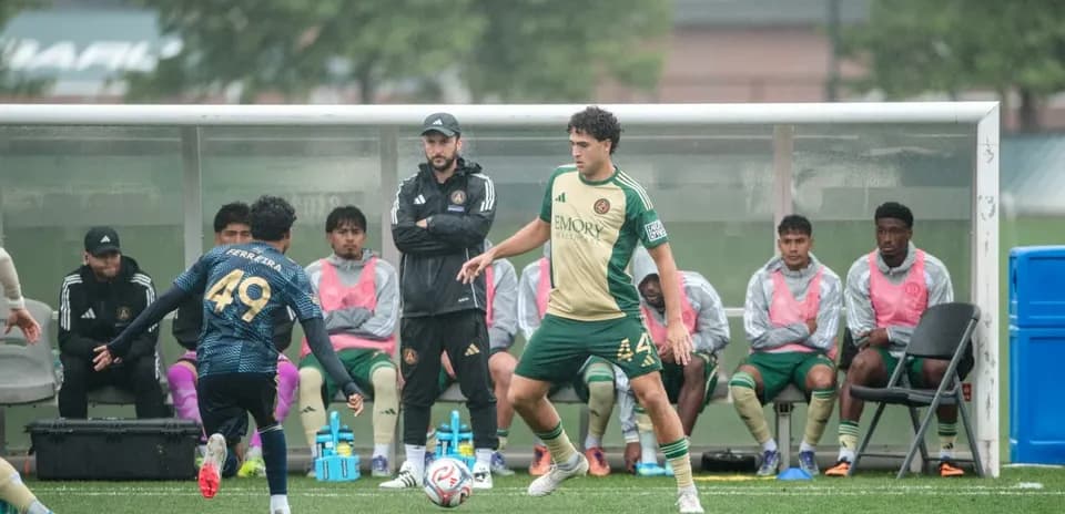 Players on the bench during MLS Next Pro match