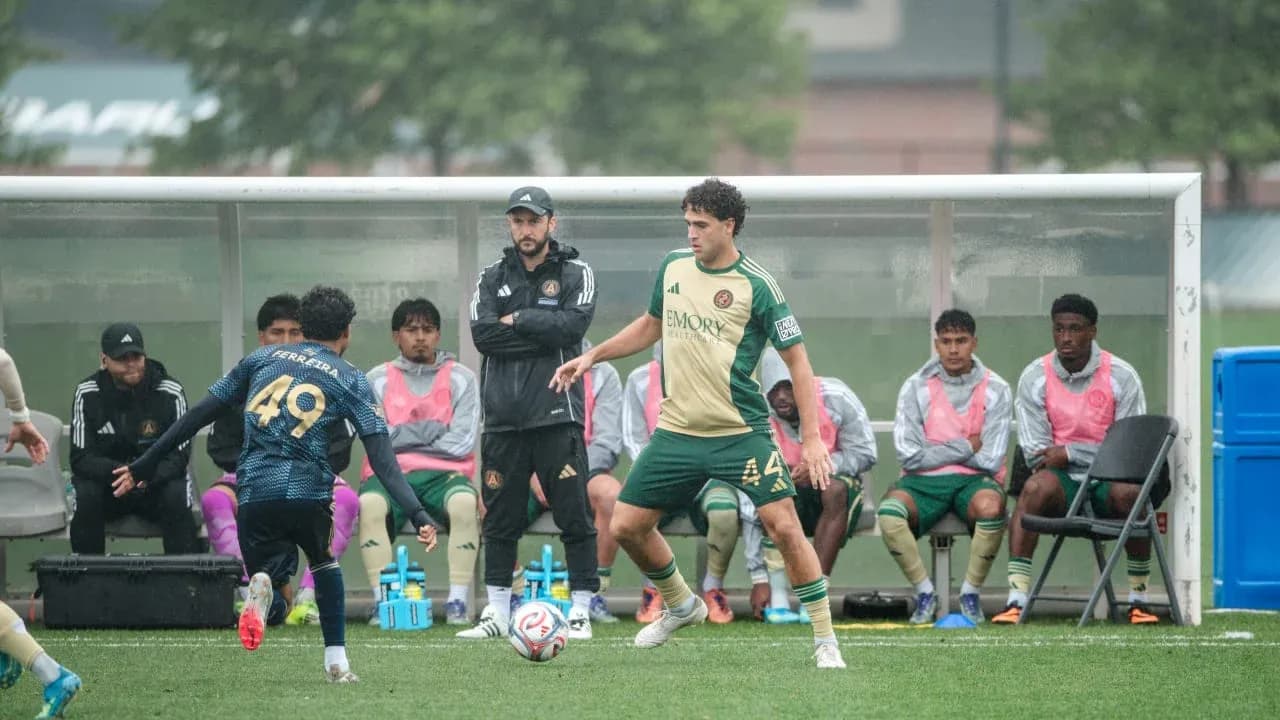 Players on the bench during MLS Next Pro match
