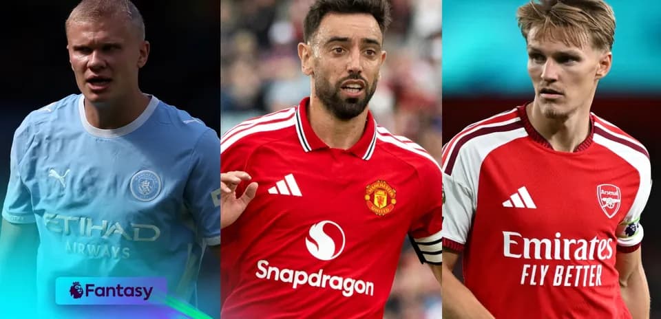 Three football players in club kits posing for photo