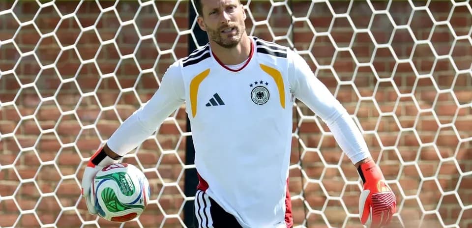Goalkeeper holding a soccer ball during training