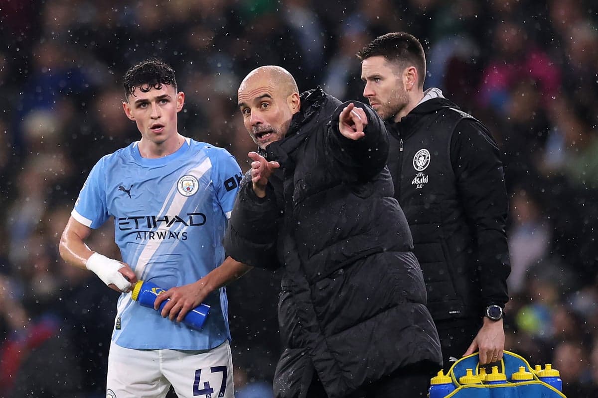Pep Guardiola instructing player during match rain