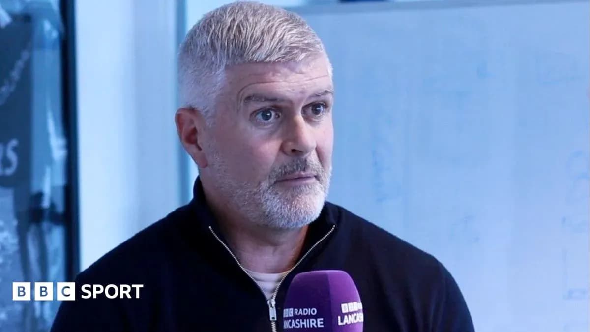 Man speaking into microphone during interview