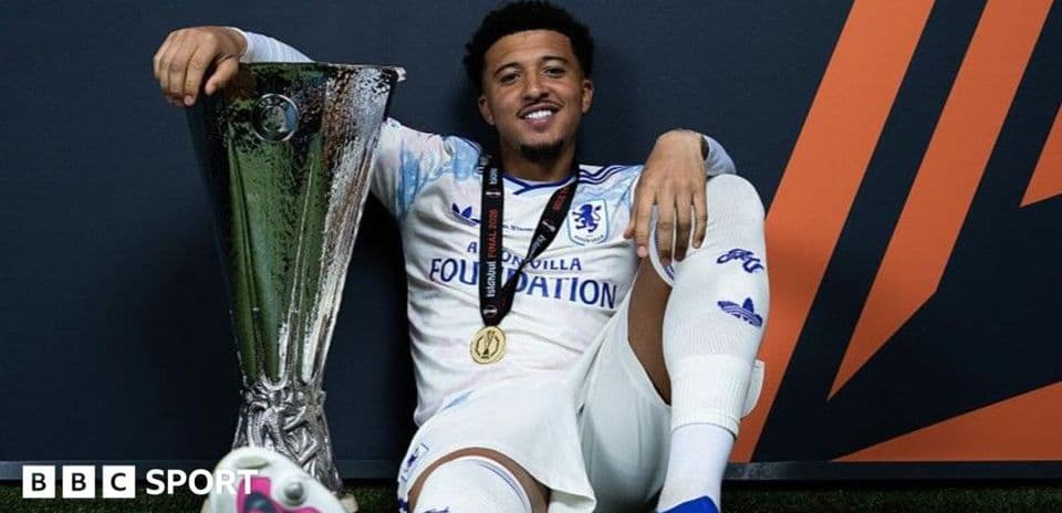 Player celebrating with UEFA trophy after victory