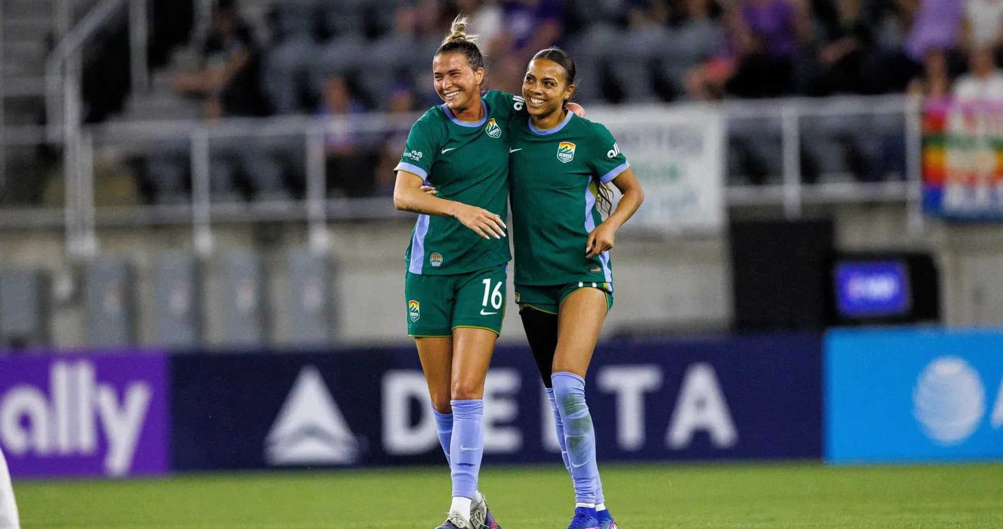 Players celebrating during NWSL match