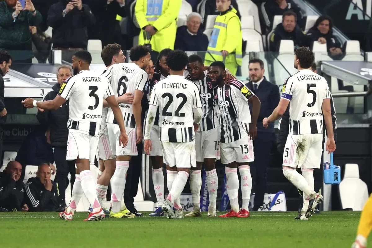 Juventus players celebrating during a match huddle