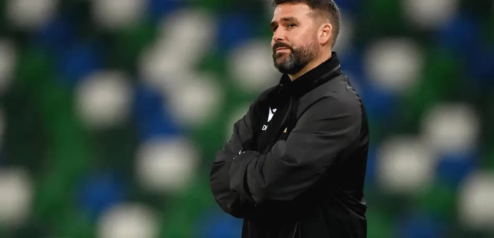 Coach observing the match from the sidelines