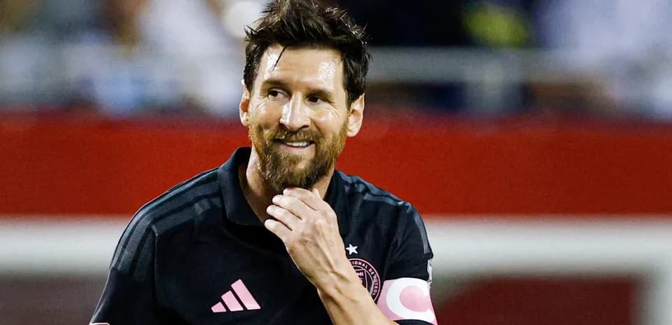 Player in black jersey smiling during match