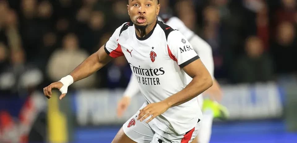 Player in action wearing AC Milan kit