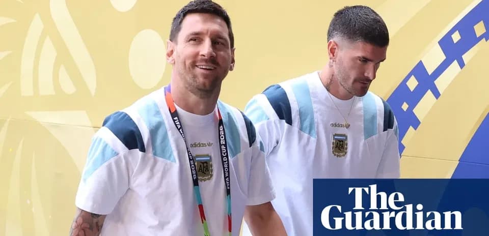 Two players walking in Argentina team apparel
