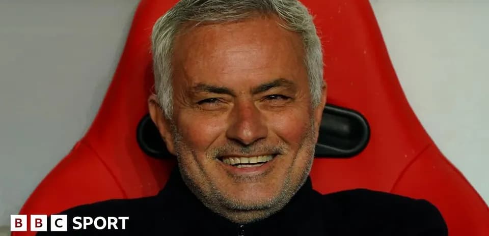 Coach smiling while seated on the bench