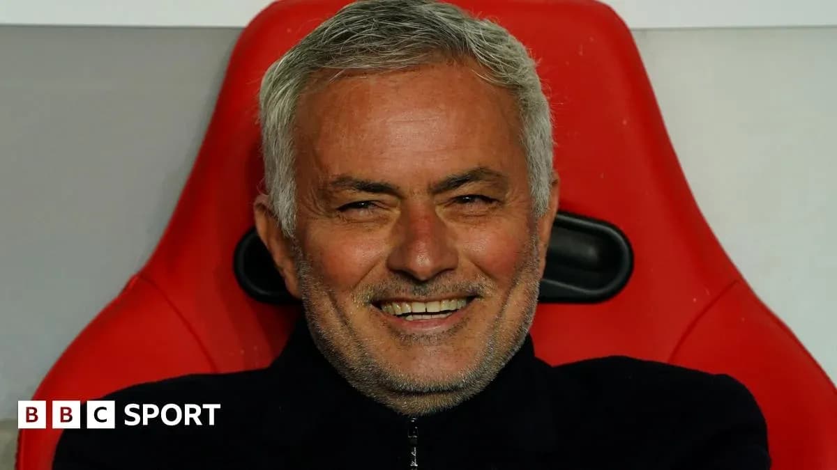 Coach smiling while seated on the bench