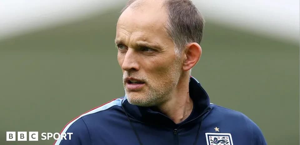 Football coach observing during training session