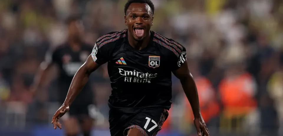 Lyon player celebrating a goal in Champions League