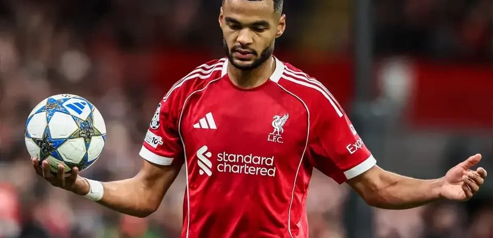 Player in red jersey holding a football