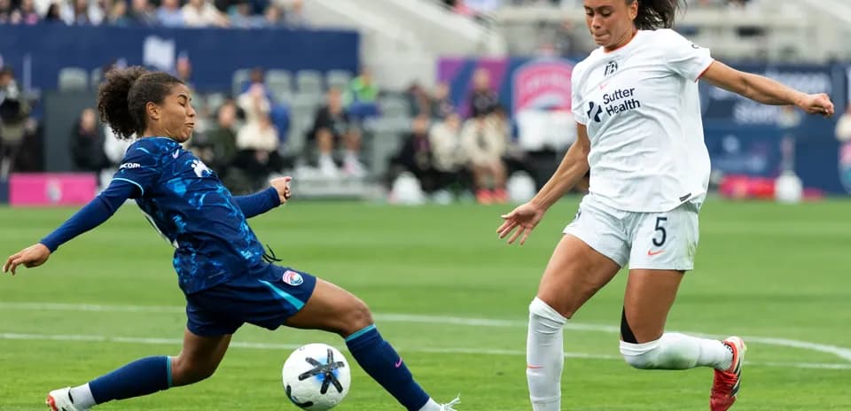 San Diego Wave player tackling Bay FC opponent