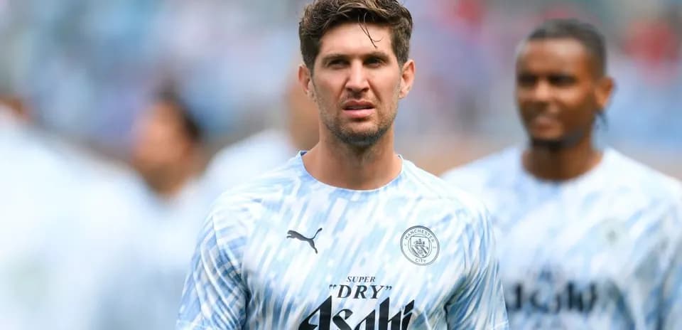 Player in Manchester City training kit during warm-up