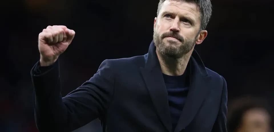 Coach celebrating victory with clenched fist gesture