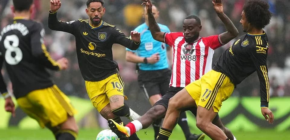 Players battling for the ball during match