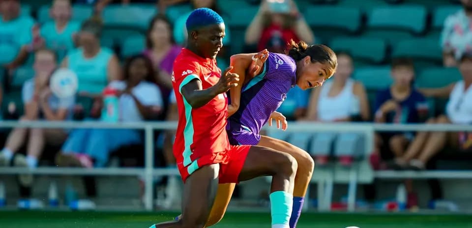 Players battling for the ball during match
