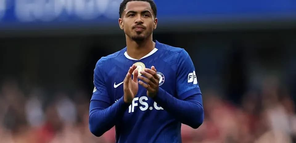 Player applauding the crowd in blue jersey