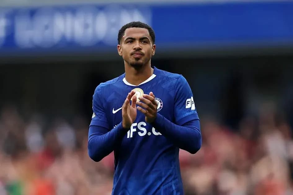 Player applauding the crowd in blue jersey