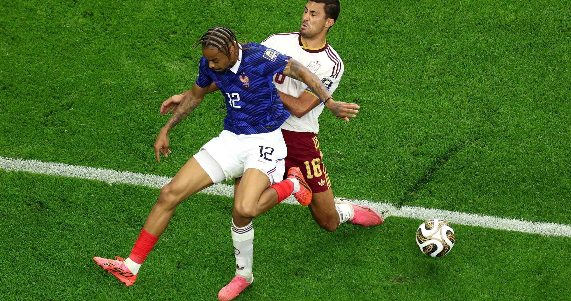 Two players competing for the ball during match