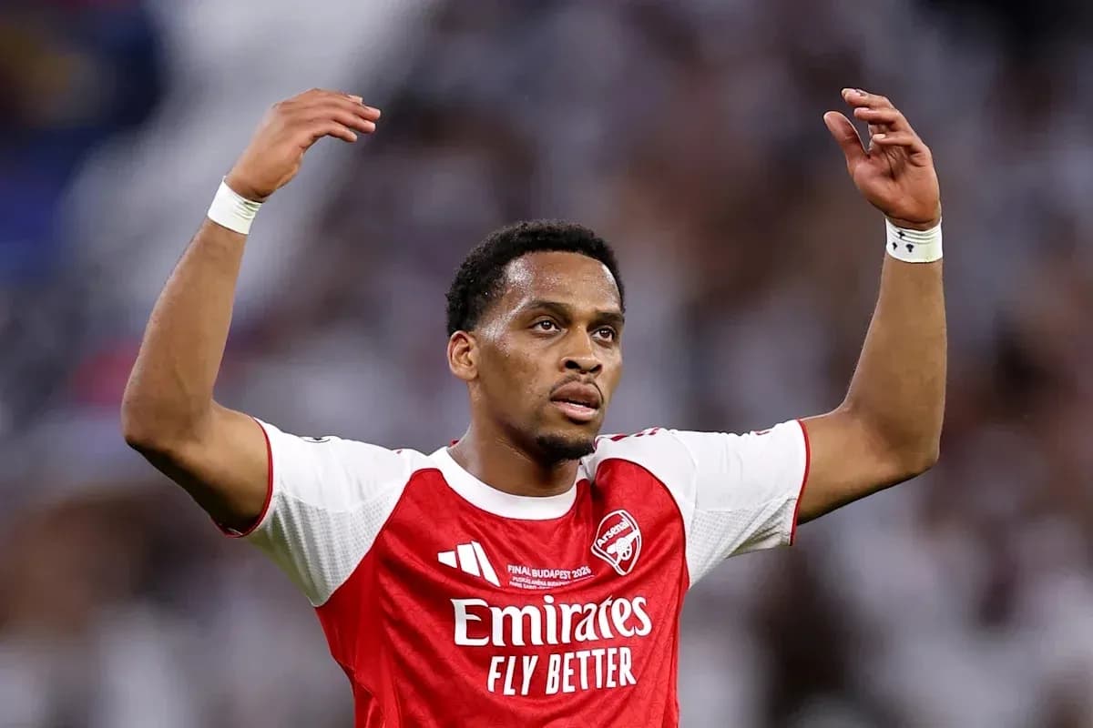Player gesturing during match wearing Arsenal jersey