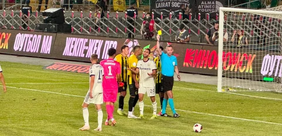 Players discussing with referee during match