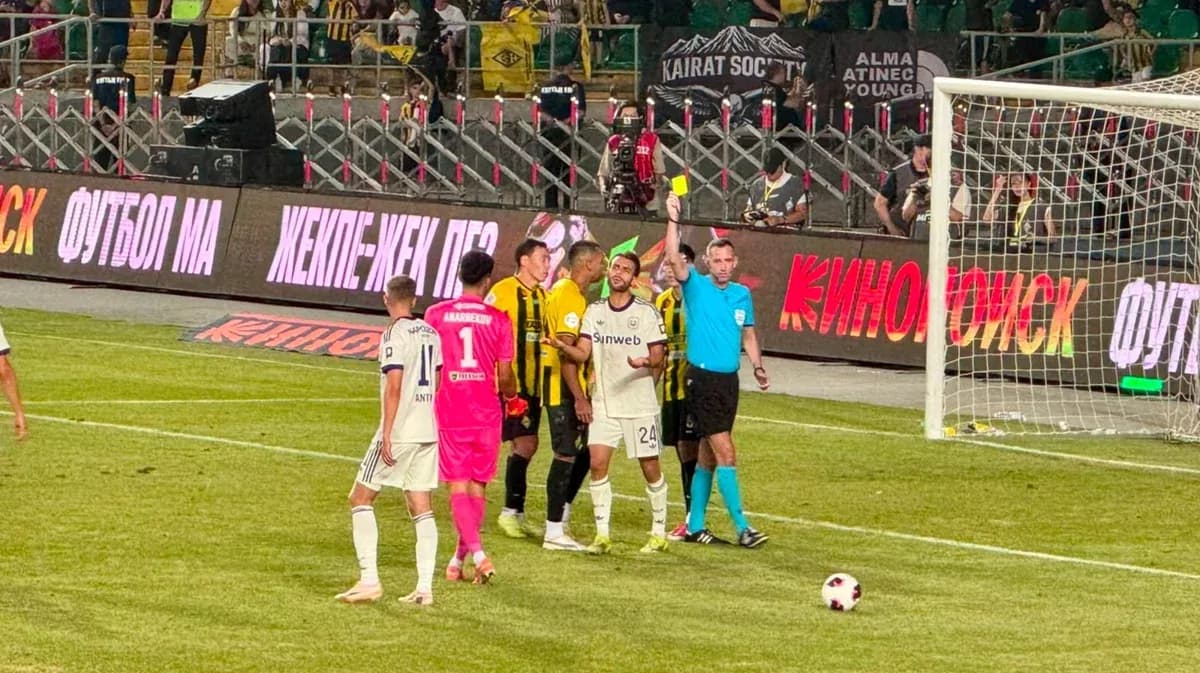 Players discussing with referee during match