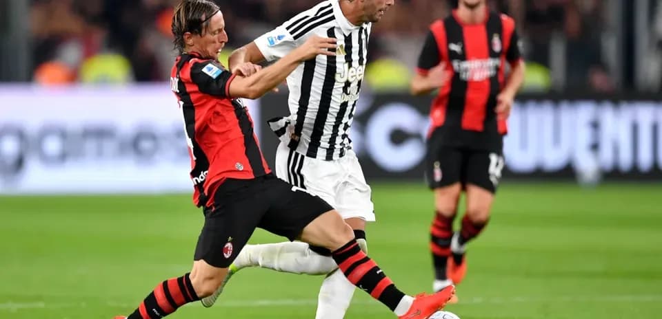 Player tackling opponent during Serie A match