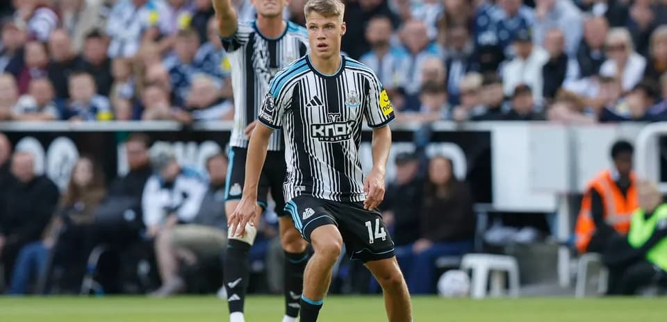 Newcastle player preparing to take a free kick