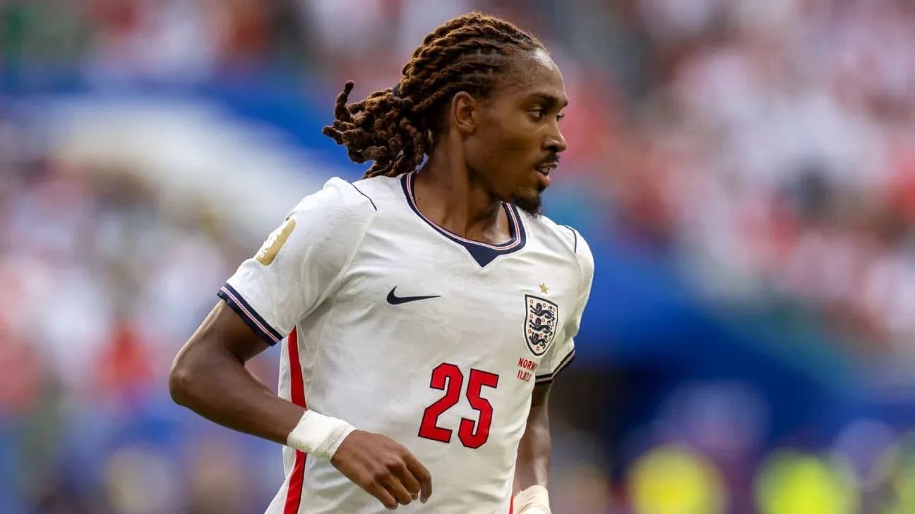 Player in England jersey running on the field