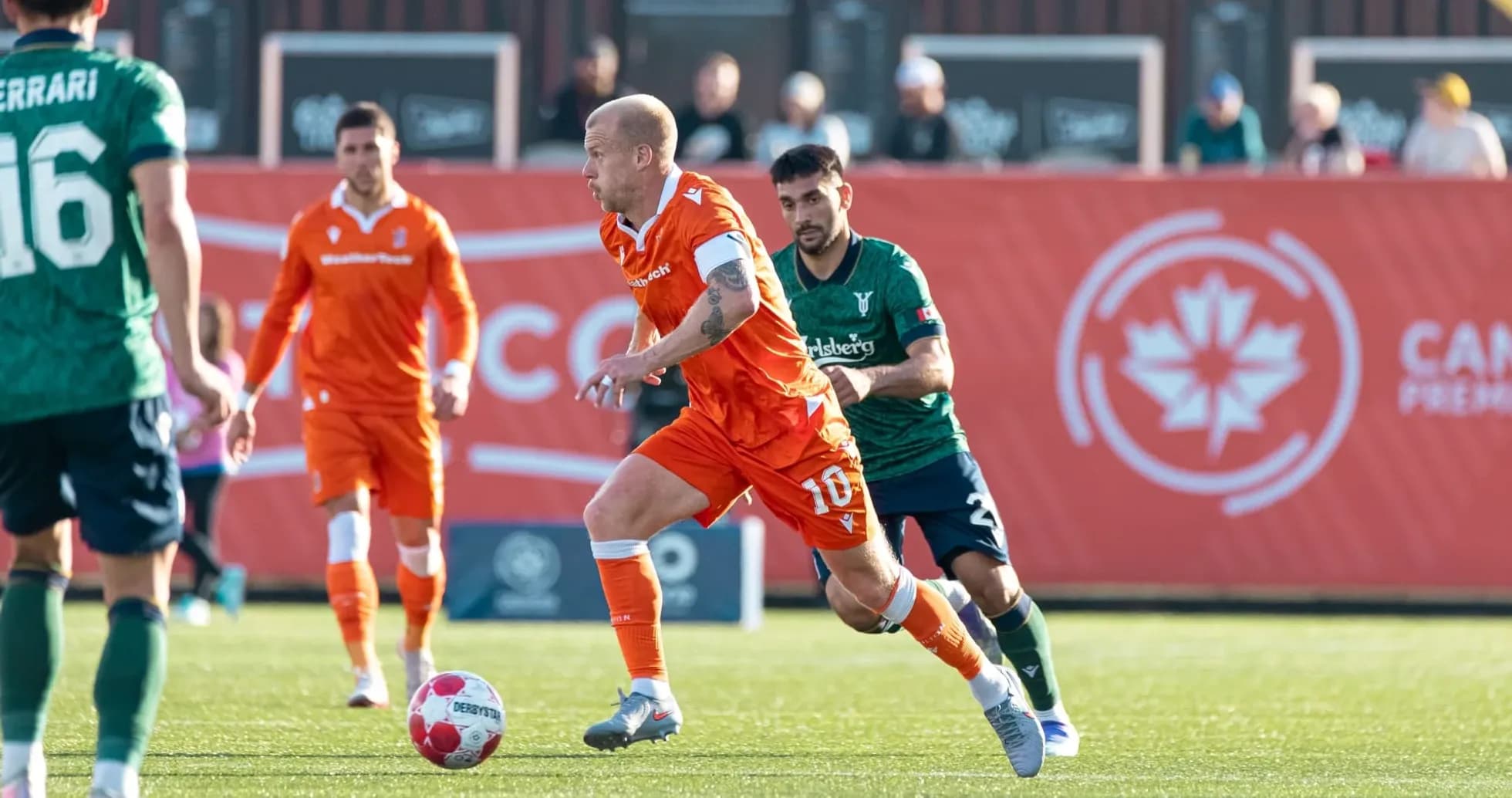 Player dribbling the ball during Forge vs York United