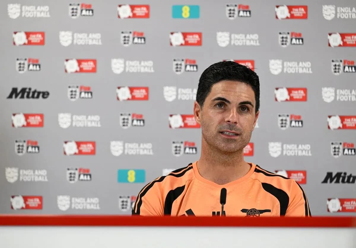 Manager speaking at press conference with England Football backdrop